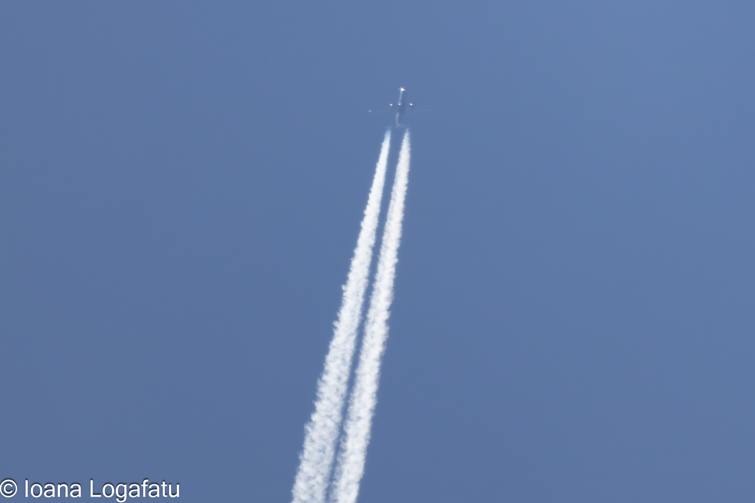 Streaks of white against a bright blue sky